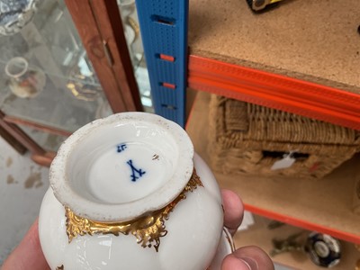 Lot 129 - Three Meissen gilt moulded breakfast cups and saucers, the saucers 15.75cm diameter