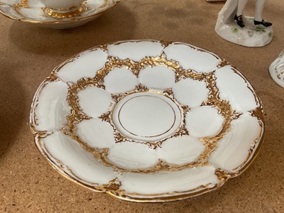 Lot 129 - Three Meissen gilt moulded breakfast cups and saucers, the saucers 15.75cm diameter