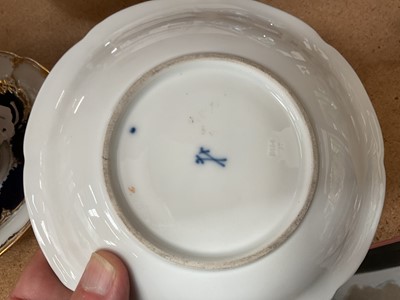 Lot 129 - Three Meissen gilt moulded breakfast cups and saucers, the saucers 15.75cm diameter