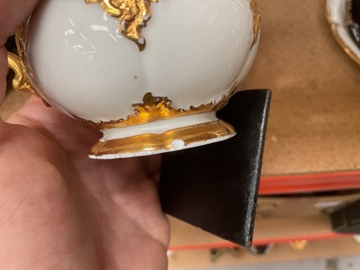 Lot 129 - Three Meissen gilt moulded breakfast cups and saucers, the saucers 15.75cm diameter