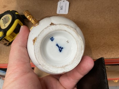 Lot 129 - Three Meissen gilt moulded breakfast cups and saucers, the saucers 15.75cm diameter