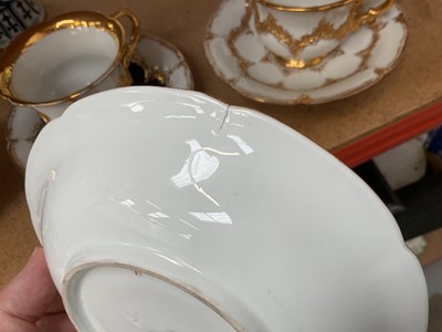 Lot 129 - Three Meissen gilt moulded breakfast cups and saucers, the saucers 15.75cm diameter
