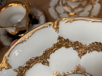 Lot 129 - Three Meissen gilt moulded breakfast cups and saucers, the saucers 15.75cm diameter