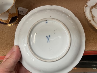 Lot 129 - Three Meissen gilt moulded breakfast cups and saucers, the saucers 15.75cm diameter
