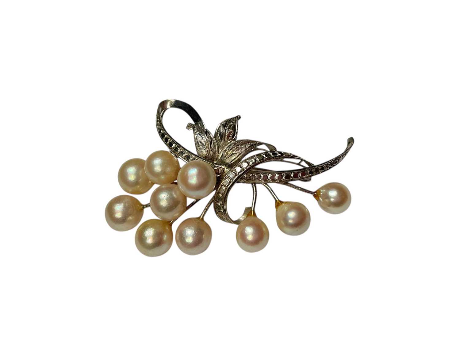 Lot 59 - Cultured pearl floral spray brooch, with applied plaque to reverse marked 'WHITE GOLD'. 65mm