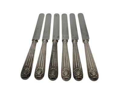 Lot 520 - Set of six silver handled table knives with shell design