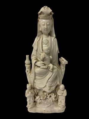 Lot 266 - Chinese blanc de chine porcelain figure of Guanyin and child