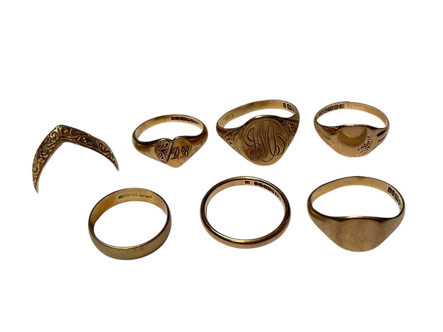Lot 180 - Seven 9ct gold rings to include four signet rings, two wedding bands and a V shaped ring