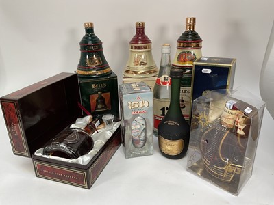 Lot 28 - Eight bottles including, three Bell's Christmas decanters, Carlos I Imperial, V.S.O.P Gaston de Lagrange Cognac, Ouzo and other bottles (8)
