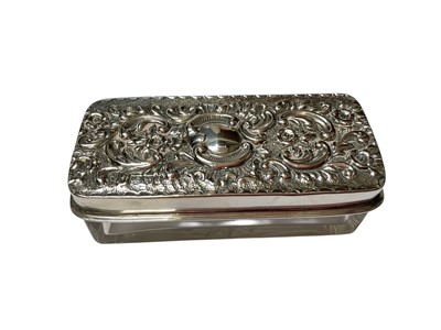 Lot 23 - Edwardian silver mounted glass scent bottle of globular form with engraved floral and ribbon decoration (Birmingham 1906), together with another antique silver mounted glass scent bottle and a s...