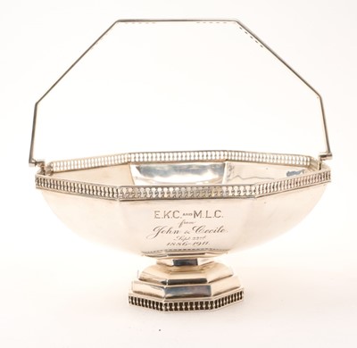 Lot 440 - George V silver swing handled cake basket of octagonal form, with pierced border
