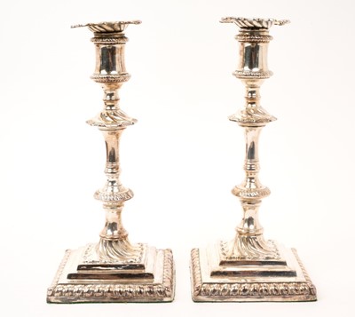 Lot 441 - Pair of late 19th/early 20th century silver plated candlesticks, in the George III style