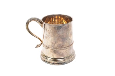 Lot 443 - 1930s silver mug of tapering form, with engraved presentation inscription and scroll handle