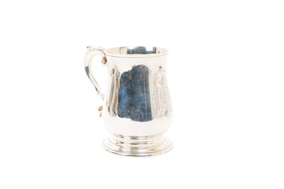 Lot 444 - Contemporary silver mug of baluster form, with engraved armorial and leaf mounted scroll handle