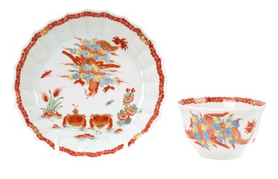 Lot 200 - A very rare Worcester tea bowl and saucer, circa 1755-60, of fluted form, painted in the Japanese style with the 'Red Crabs' pattern, the saucer 11.75cm diameter