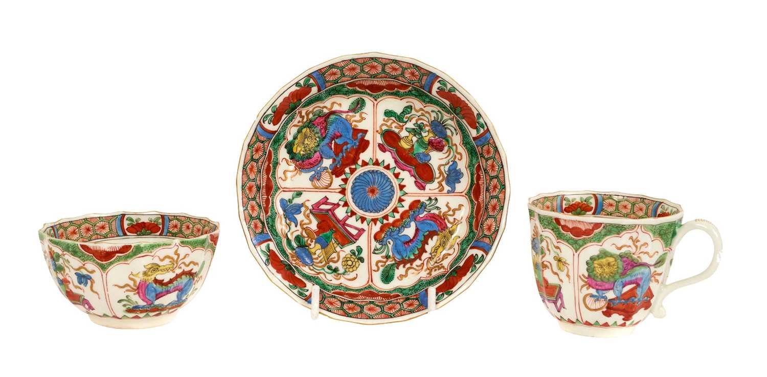 Lot 22 - Worcester trio, circa 1770, of fluted form, polychrome decorated with the 'Dragons in Compartments' pattern, pseudo-Chinese marks to bases, the saucer 11.75cm diameter