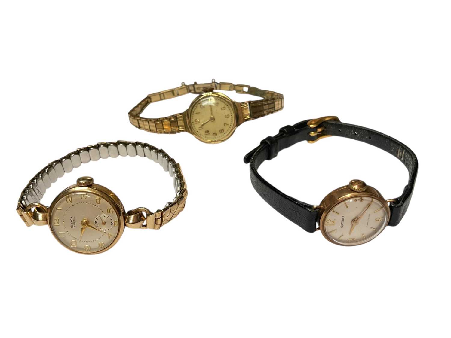 Lot 31 - 1950s 9ct gold cased Griffon ladies' wristwatch on expandable gold plated bracelet, 9ct gold cased Seiko ladies wristwatch on leather strap and a gold plated watch (3)