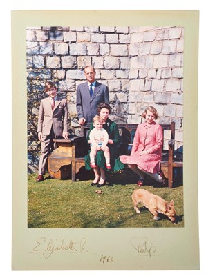 Lot 20 - H.M. Queen Elizabeth II and H.R.H. The Duke of Edinburgh, fine signed 1963 presentation portrait colour photograph of the Royal couple with their children and a Corgi in the garden at Windsor, sig...