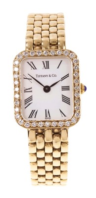 Lot 783 - Tiffany & Co 14ct gold and diamond ladies' quartz wristwatch, boxed