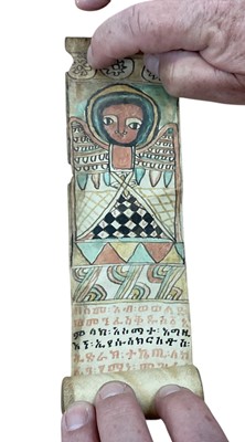 Lot 2417 - Group of items of religious interest, including a miniature holy book on vellum, written in an Abyssinian language and with old paper label, an Ethiopian healing scroll, and a framed manuscript...
