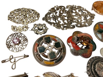 Lot 46 - Collection of silver and white metal brooches including Scottish hardstone brooches, agate brooches, paste set brooches, Victorian silver buckle, silver and mother of pearl fruitknife etc