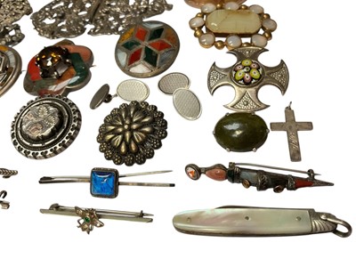 Lot 46 - Collection of silver and white metal brooches including Scottish hardstone brooches, agate brooches, paste set brooches, Victorian silver buckle, silver and mother of pearl fruitknife etc