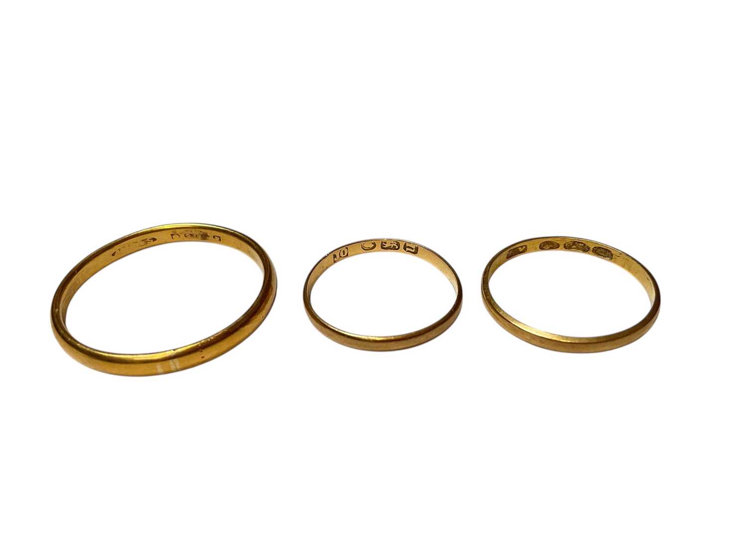 Lot 50 - 22ct gold wedding ring, together with a Georgian gold wedding ring and an early Victorian gold wedding ring (3)
