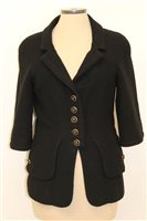 Lot 3054 - Chanel black bouclé jacket with logo gilt and...