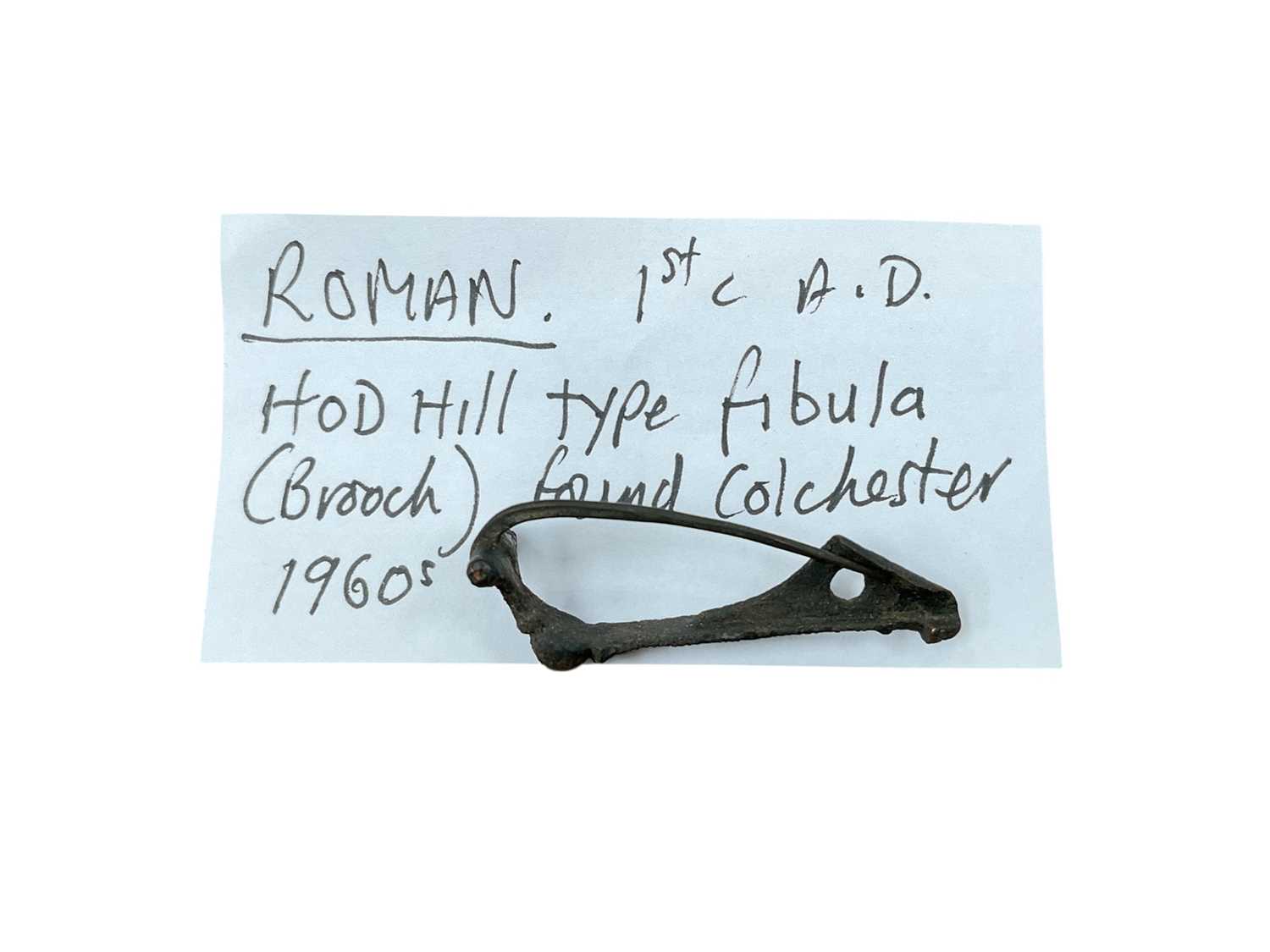 Lot 2494 - Roman brooch with provenance note, found in Colchester in the 1960's.