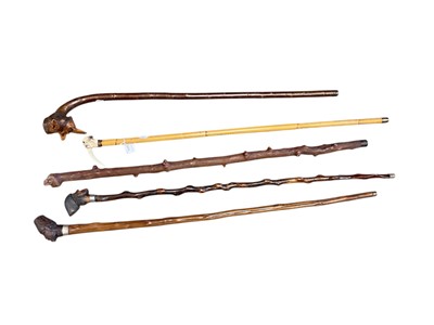 Lot 2479 - Group of five walking sticks, each with carved figural handles, including one horn (5)