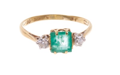 Lot 643 - Emerald and diamond three stone ring
