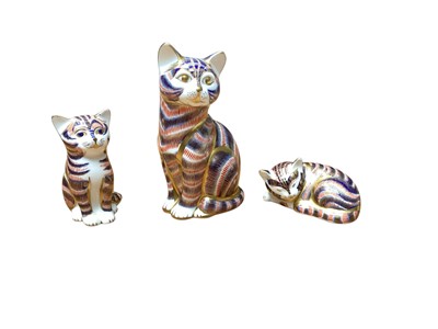 Lot 973 - Three Royal Crown Derby cat paperweights