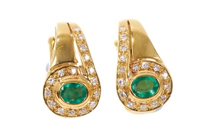 Lot 719 - Pair of emerald and diamond earrings
