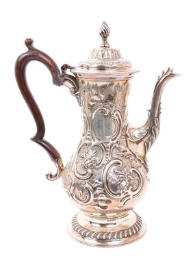 Lot 470 - George II silver coffee pot of baluster form, with later chased decoration