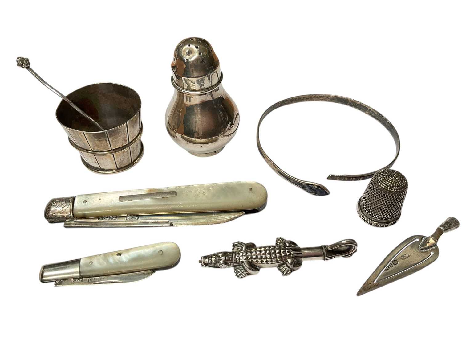 Lot 66 - Chinese silver salt in the form of a wooden bucket, salt spoon and a Chinese silver pepperette, together with a Victorian silver and mother of pearl fruitknife, one other smaller, niello snake b...