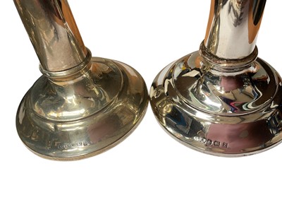 Lot 67 - Two similar silver candlesticks, set of six 1920s silver coffee bean end spoons in fitted case, set of six silver handled butter knives in fitted case, other silver items and flatware