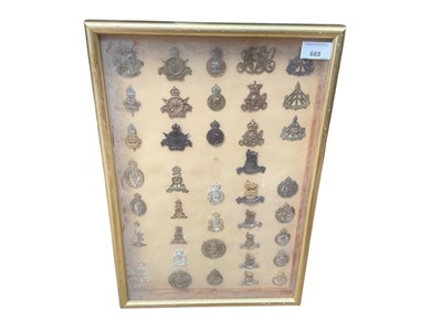 Lot 669 - Collection of forty two various British Military cap badges to include Royal Defence Corps, Royal Corps of Signals and ATS, mounted in glazed frame, (42).