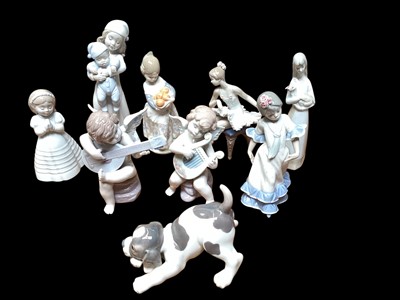 Lot 985 - Collection of six Lladro porcelain figures including cherubs playing musical instruments, ballerina, girl with oranges etc, together with two Nao figures and one other unmarked figure (9)