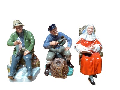 Lot 994 - Three Royal Doulton figures - A Good Catch HN2258, The Lobster Man HN2317 and The Judge HN2443, together with a character jug - The Lawyer D6498 and a Toby jug - Sir John Falstaff (5)