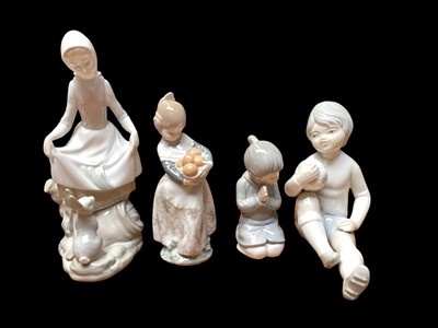 Lot 995 - Six Spanish figures including Lladro, Nao and others, together with a Goebel figure and another figure (8)