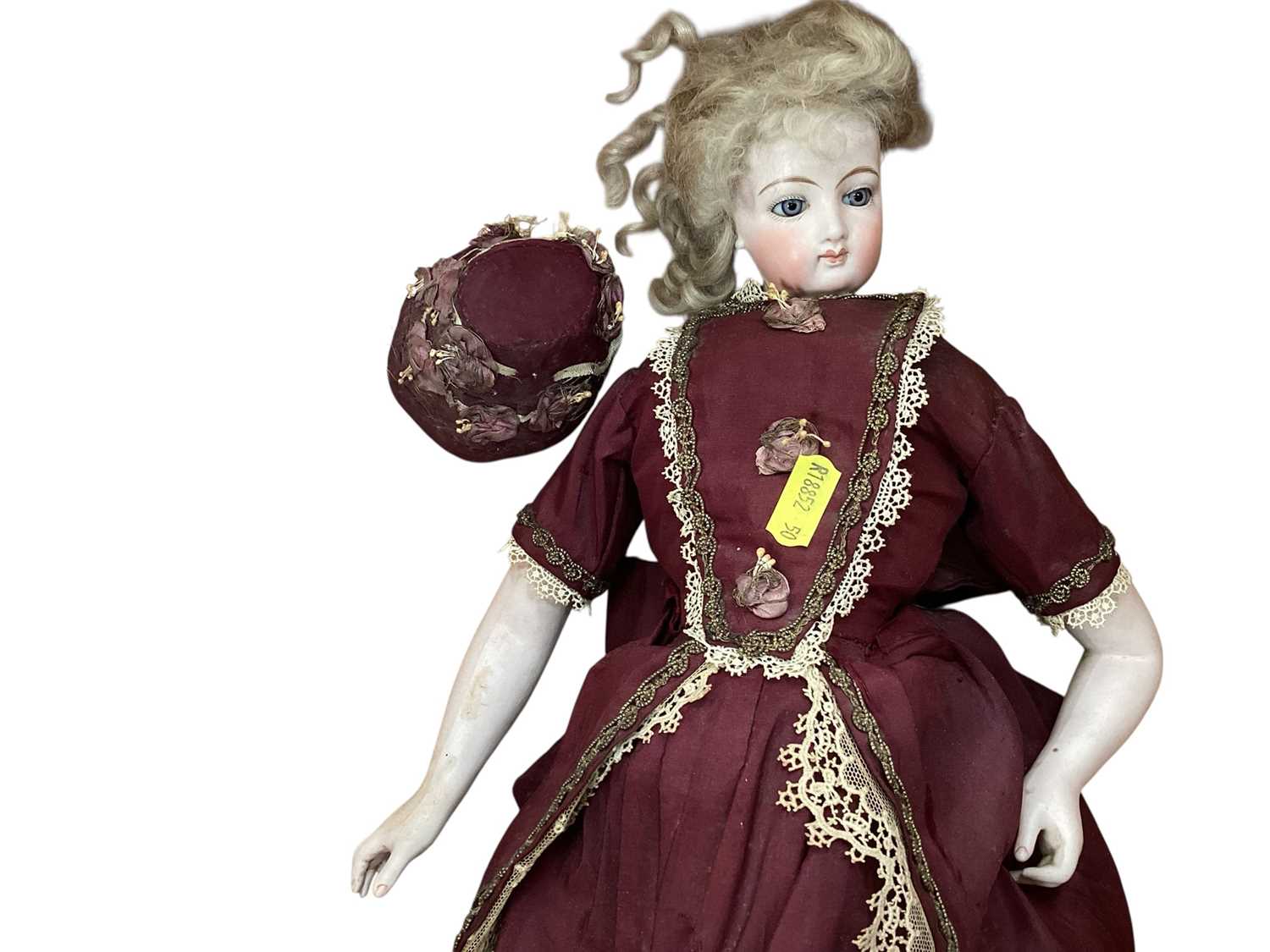 Lot 2726 - 19th century doll with porcelain head and body in period costume.