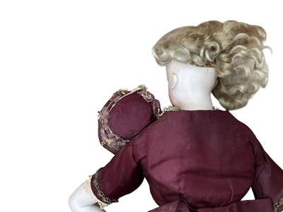 Lot 2726 - 19th century doll with porcelain head and body in period costume.