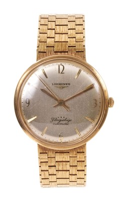 Lot 785 - Longines Flagship automatic 9ct gold wristwatch on an integral 9ct gold articulated link bracelet