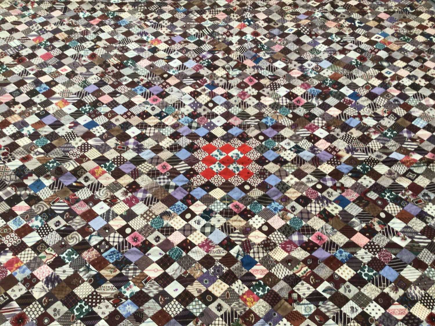 Lot 2126 - Antique Patchwork quilt made up from very small patches mainly printed cotton.