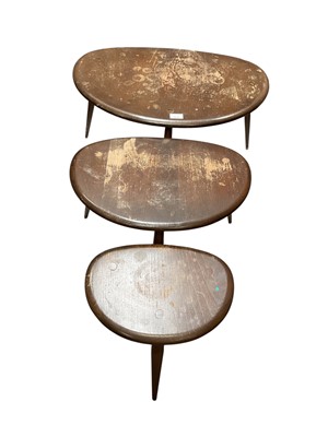 Lot 1237 - Ercol nest of three pebble tables