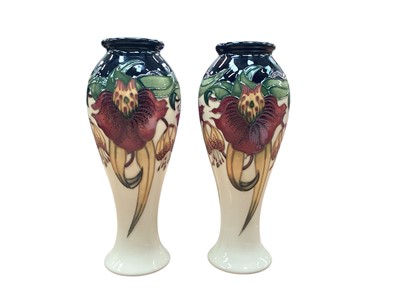 Lot 1011 - Pair of Moorcroft pottery vase decorated in the Anna Lily pattern, dated 98, 21cm high