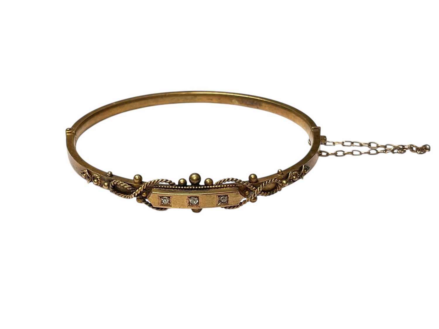 Lot 224 - Edwardian 15ct gold diamond three stone hinged bangle with applied ropetwist and ball decoration (Birmingham 1902)