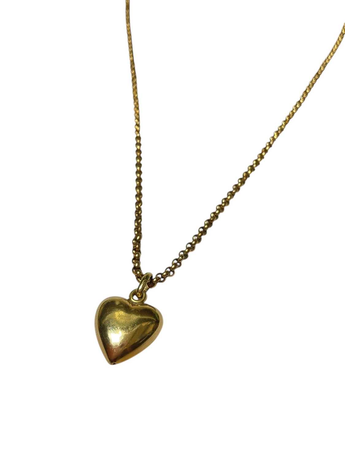 Lot 124 - Gold heart pendant (stamped 585), 21mm, on a yellow metal belcher link chain, 50cm long