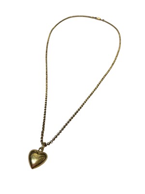 Lot 124 - Gold heart pendant (stamped 585), 21mm, on a yellow metal belcher link chain, 50cm long