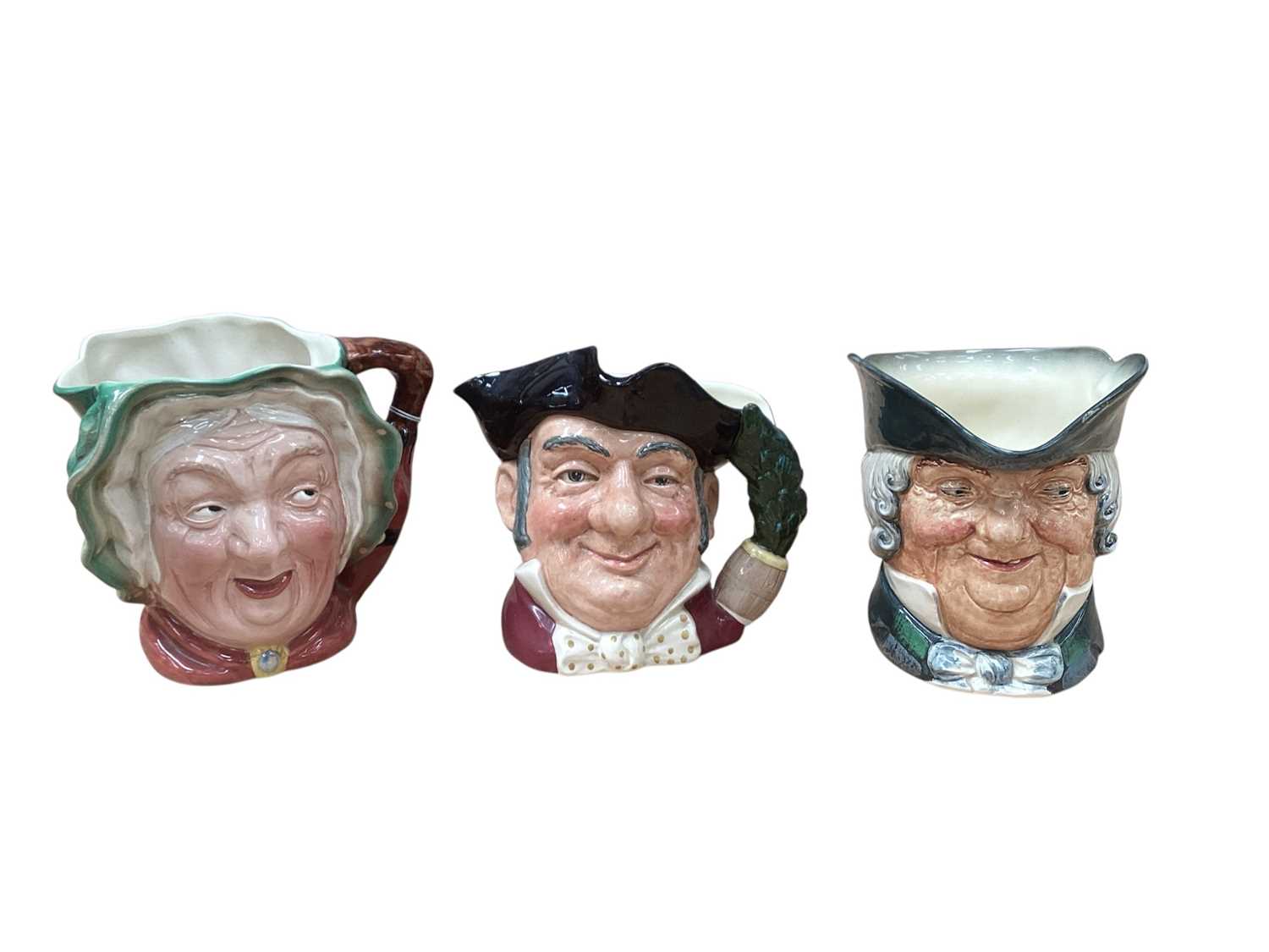 Lot 1044 - Five Royal Doulton character jugs - Merlin D6529, Dick Turpin, Lobster Man D6617, Mine Host D6468 and Parson Brown, together with a Beswick character jug - Sairey Gamp (6)